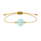 Pulsera de aguamarina natural con hilo dorado y balines en oro de 18 quilates.