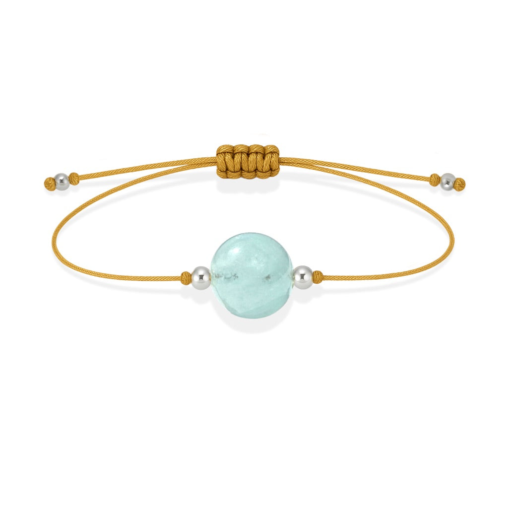 Pulsera de aguamarina natural con hilo dorado y balines en plata 925.