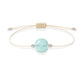 Pulsera de aguamarina natural con hilo color hueso y balines en plata 925.