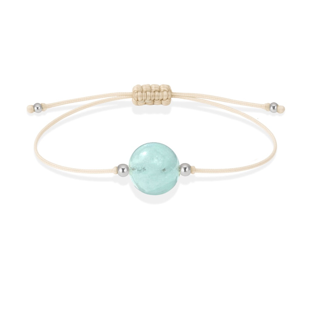 Pulsera de aguamarina natural con hilo color hueso y balines en plata 925.