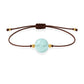 Pulsera de aguamarina natural con hilo marrón y balines en oro de 18 quilates.
