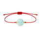 Pulsera de aguamarina natural con hilo rojo y balines en oro de 18 quilates.
