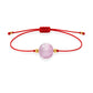 Pulsera de kunzita natural con hilo rojo y balines en oro de 18 quilates.