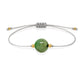Pulsera de esmeralda natural con hilo plateado y balines en oro de 18 quilates.