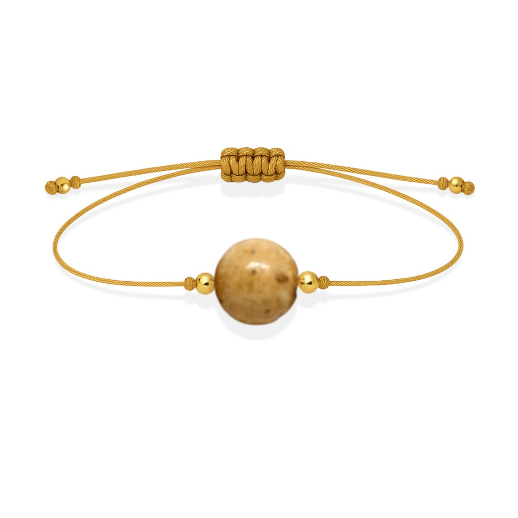 Pulsera de jaspe paisino natural con hilo dorado y balines en oro de 18 quilates.