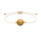 Pulsera de jaspe paisino natural con hilo color hueso y balines en oro de 18 quilates.