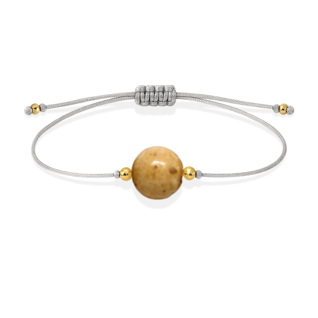 Pulsera de jaspe paisino natural con hilo plateado y balines en oro de 18 quilates.