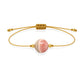 Pulsera de rodocrosita natural con hilo dorado y balines en oro de 18 quilates.