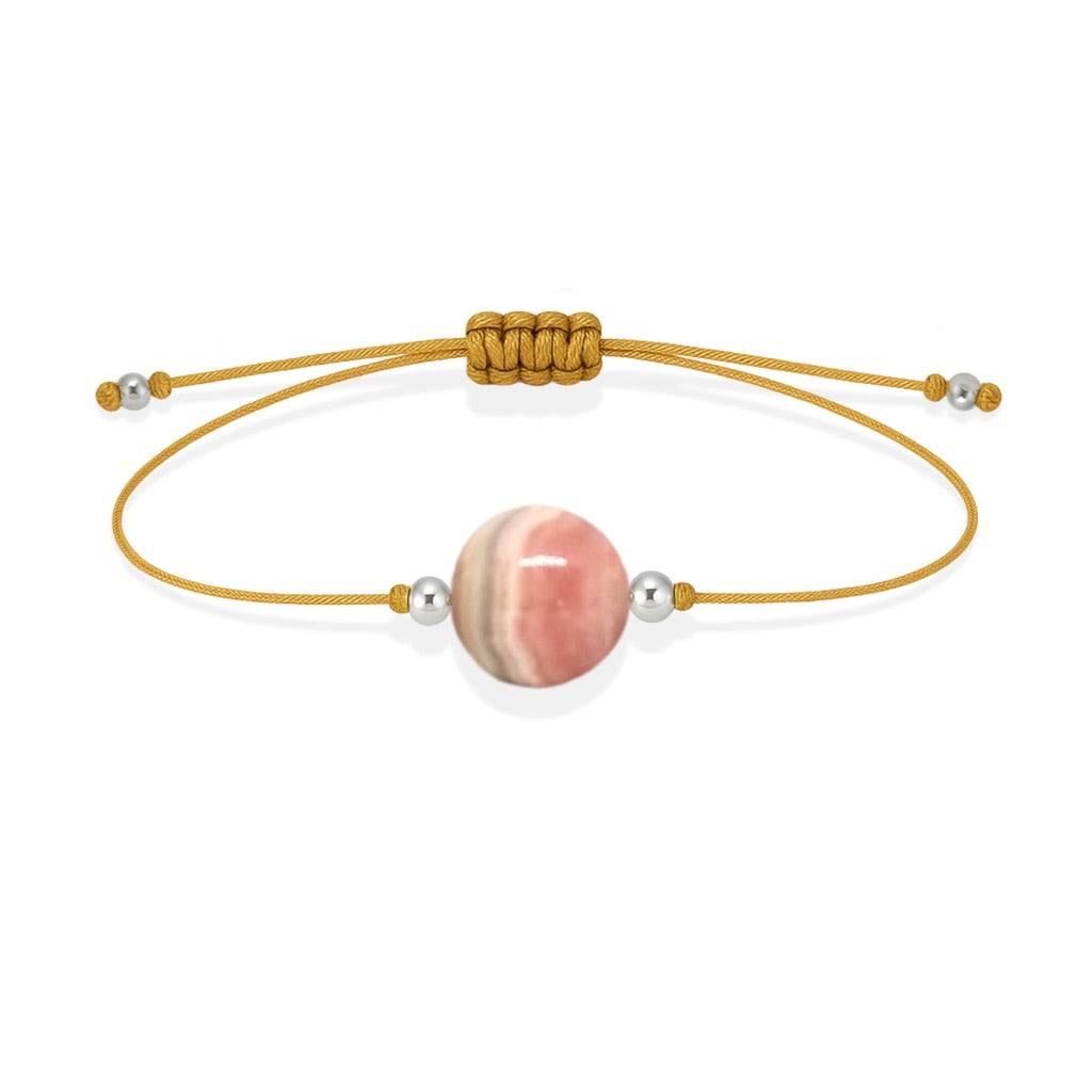 Pulsera de rodocrosita natural con hilo dorado y balines en plata 925.