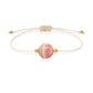 Pulsera de rodocrosita natural con hilo color hueso y balines en oro de 18 quilates.