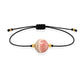 Pulsera de rodocrosita natural con hilo negro y balines en oro de 18 quilates.