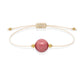 Pulsera de rodonita natural con hilo color hueso y balines en oro de 18 quilates.