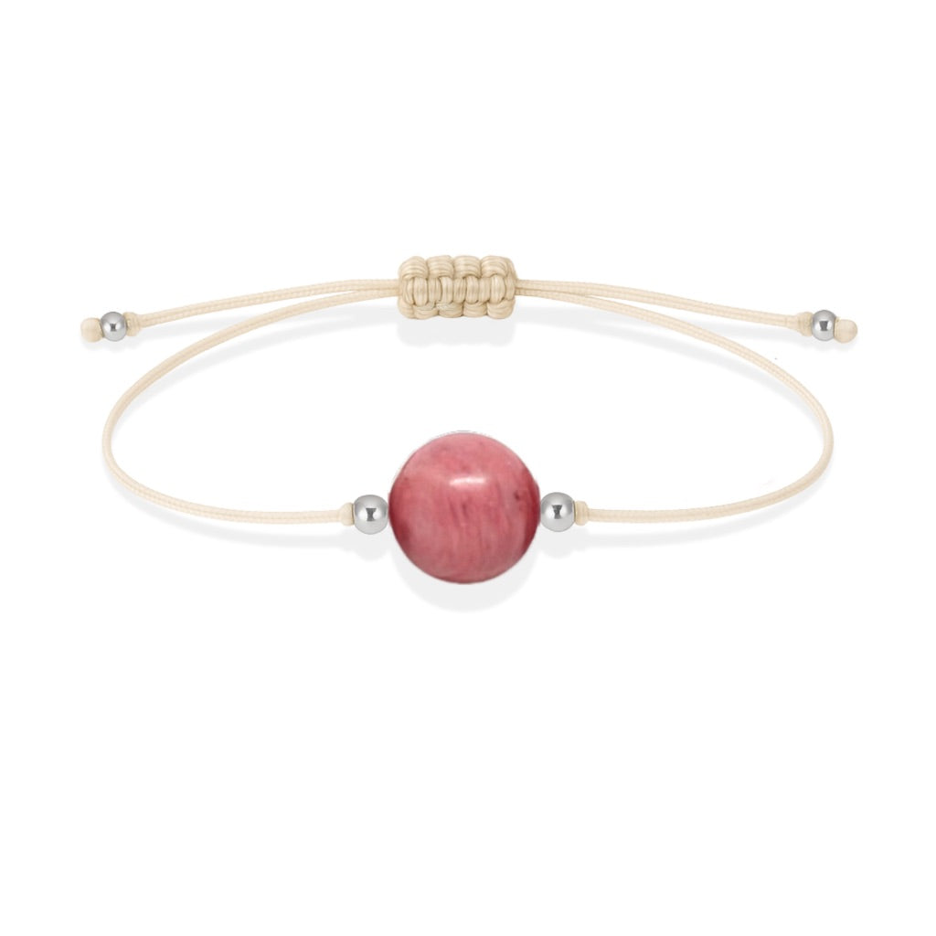 Pulsera de rodonita natural con hilo color hueso y balines en plata 925.
