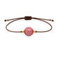 Pulsera de rodonita natural con hilo marrón y balines en oro de 18 quilates.