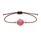 Pulsera de rodonita natural con hilo marrón y balines en plata 925.