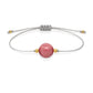 Pulsera de rodonita natural con hilo plateado y balines en oro de 18 quilates.