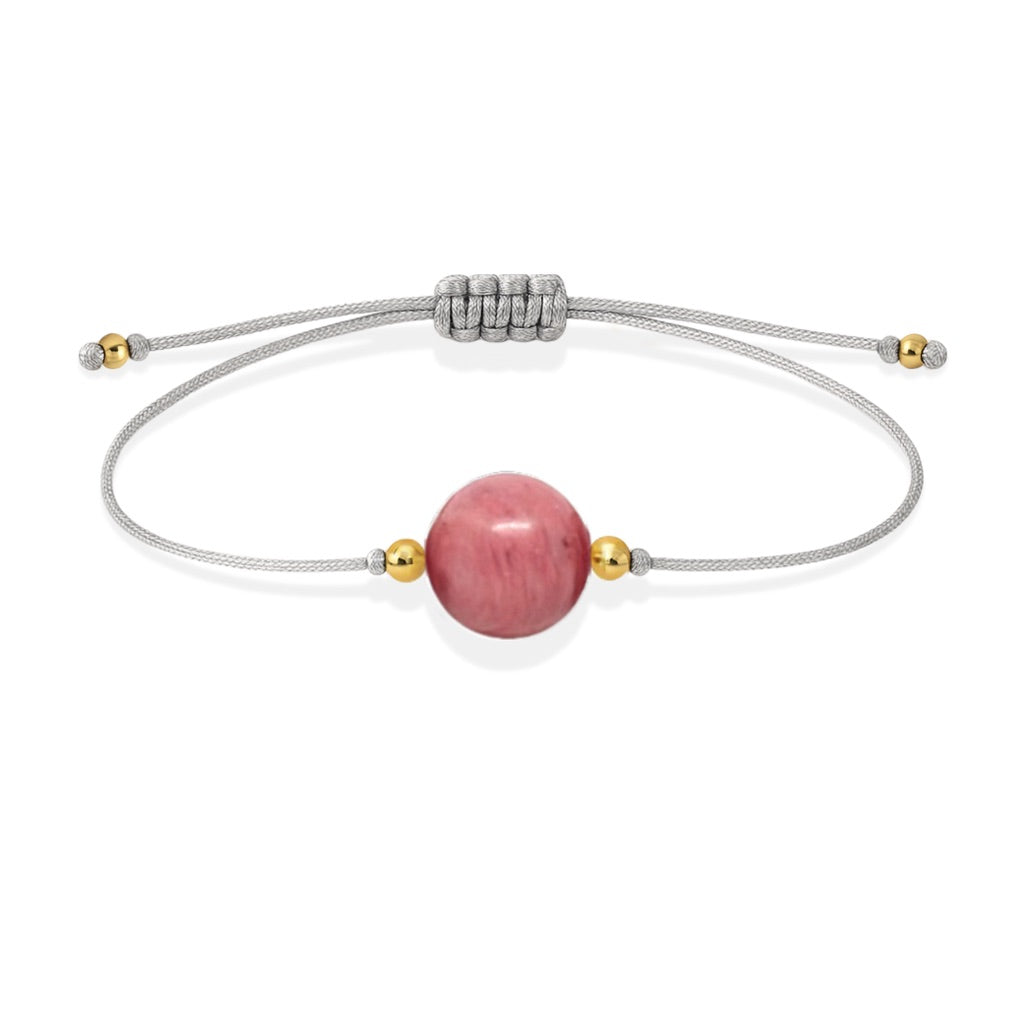 Pulsera de rodonita natural con hilo plateado y balines en oro de 18 quilates.