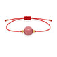 Pulsera de rodonita natural con hilo rojo y balines en oro de 18 quilates.